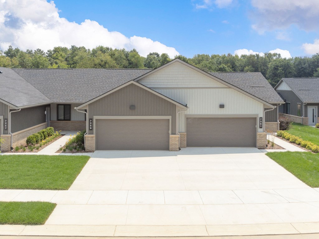 a house with a driveway and a garage door